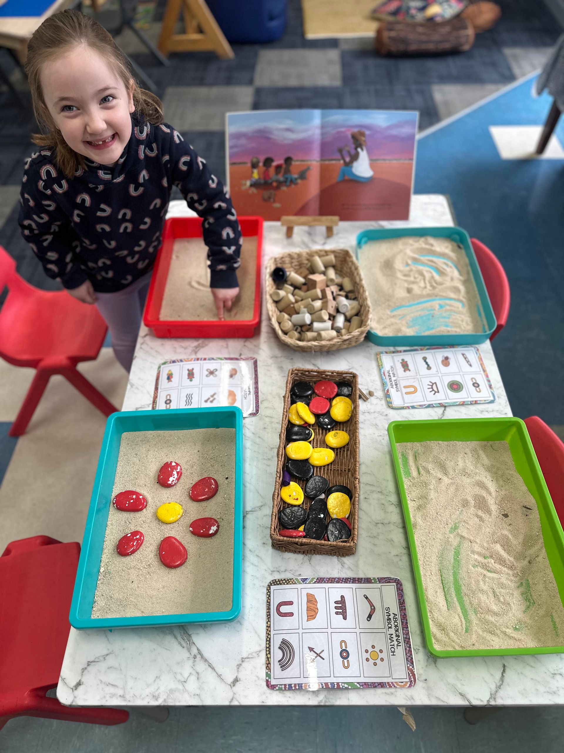 A child engaged in a playful learning activity
